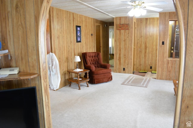 595 N 6th St, Montpelier, ID 83254 - sitting room with ceiling fan, carpet flooring, and wood walls