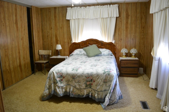 595 N 6th St, Montpelier, ID 83254 - carpeted bedroom featuring wooden walls and visible vents