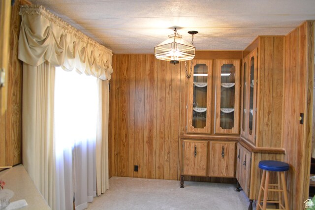595 N 6th St, Montpelier, ID 83254 - dining area featuring light carpet and wooden walls