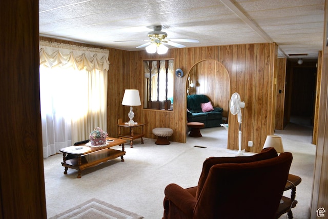595 N 6th St, Montpelier, ID 83254 - carpeted living room with wooden walls and ceiling fan
