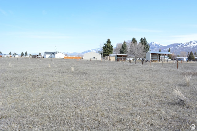 595 N 6th St, Montpelier, ID 83254 - view of yard with a mountain view, fence, and a rural view