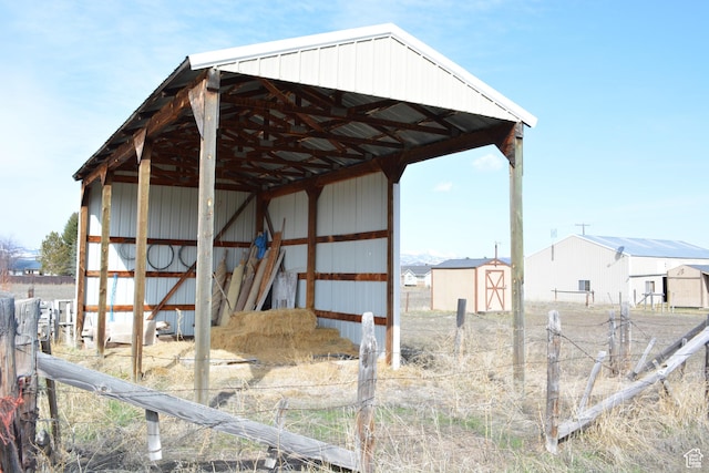 595 N 6th St, Montpelier, ID 83254 - view of pole building with fence and a shed