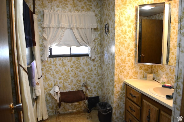 595 N 6th St, Montpelier, ID 83254 - bathroom featuring wallpapered walls and vanity