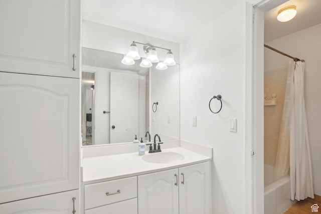 full bath with vanity and shower / tub combo with curtain