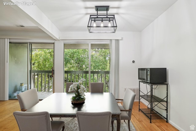 dining area featuring light wood-style flooring