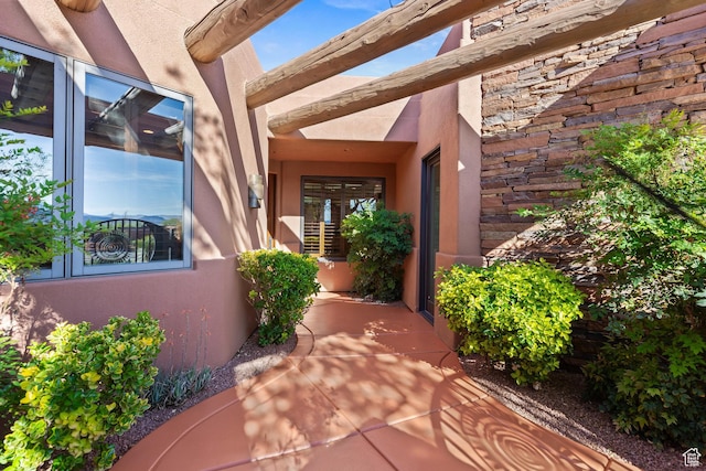 2410 W Entrada Trl Unit 15, St George, UT 84770 - doorway to property with stone siding and stucco siding
