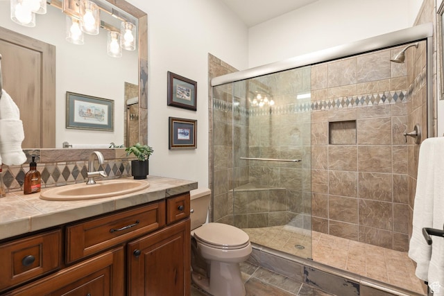 2410 W Entrada Trl Unit 15, St George, UT 84770 - bathroom with toilet, vanity, and a stall shower