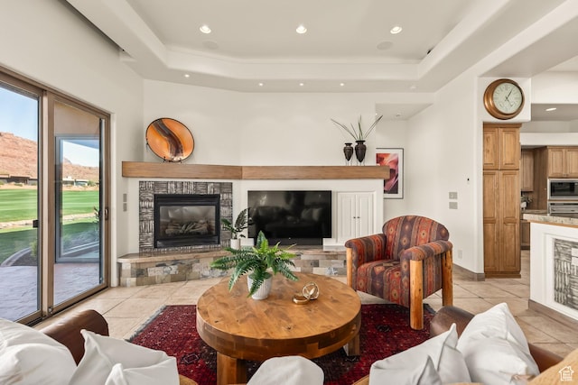 2410 W Entrada Trl Unit 15, St George, UT 84770 - living area featuring a tray ceiling, a fireplace, recessed lighting, and light tile patterned flooring