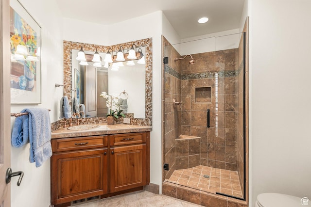2410 W Entrada Trl Unit 15, St George, UT 84770 - full bathroom with a stall shower, vanity, toilet, tile patterned flooring, and visible vents
