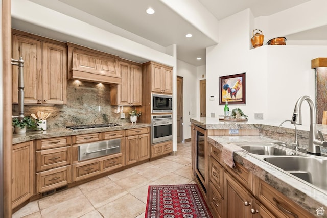 2410 W Entrada Trl Unit 15, St George, UT 84770 - kitchen with tasteful backsplash, a sink, a warming drawer, custom range hood, and appliances with stainless steel finishes