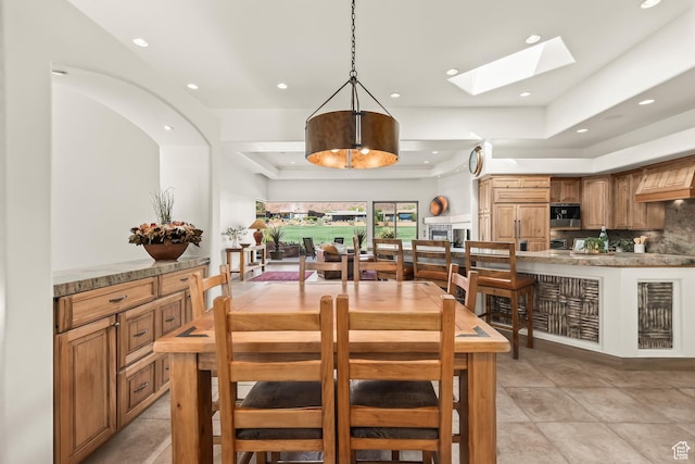 2410 W Entrada Trl Unit 15, St George, UT 84770 - dining space with recessed lighting, a skylight, and light tile patterned floors