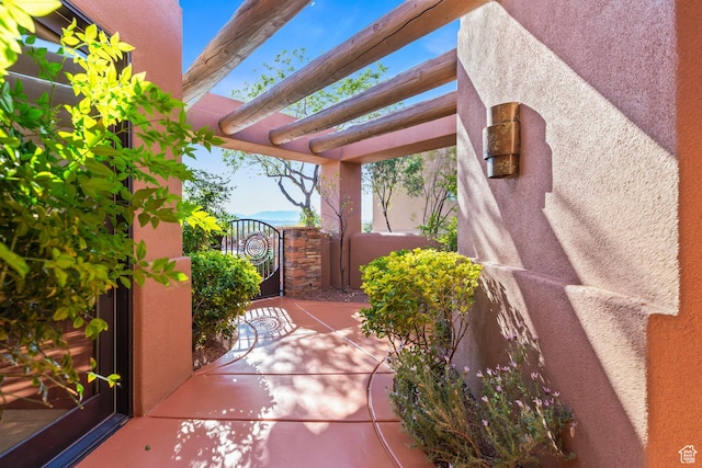 2410 W Entrada Trl Unit 15, St George, UT 84770 - view of patio / terrace featuring a pergola and a gate