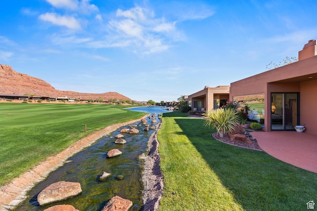 2410 W Entrada Trl Unit 15, St George, UT 84770 - view of yard with golf course view and a water view