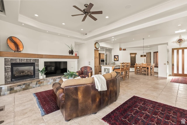 2410 W Entrada Trl Unit 15, St George, UT 84770 - living area with recessed lighting, a glass covered fireplace, a ceiling fan, and light tile patterned floors