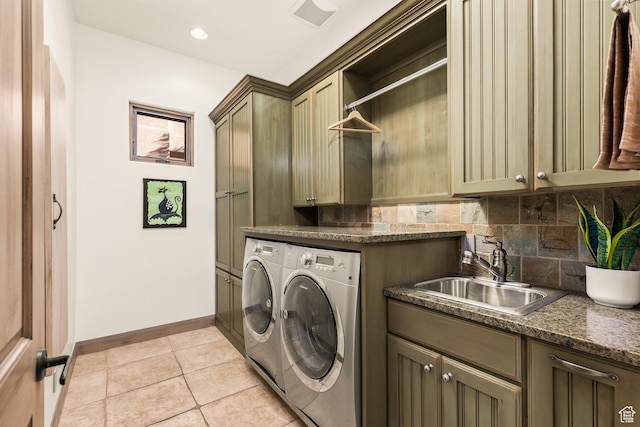 2410 W Entrada Trl Unit 15, St George, UT 84770 - laundry area with a sink, light tile patterned floors, cabinet space, baseboards, and independent washer and dryer