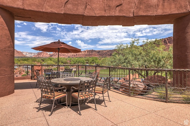 2410 W Entrada Trl Unit 15, St George, UT 84770 - view of patio / terrace with outdoor dining area and a mountain view