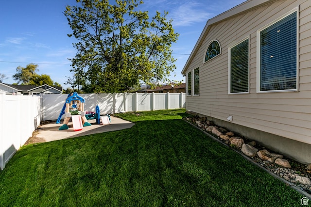 view of yard with a patio area and a fenced backyard
