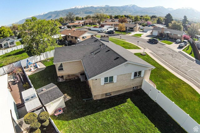 aerial view featuring a mountain view and a residential view