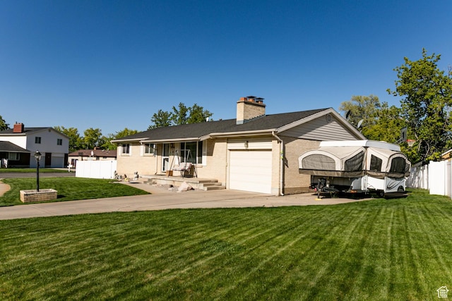 single story home with a chimney, fence, concrete driveway, a front yard, and a garage