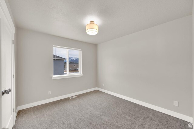 227 N 250 E, Salem, UT 84653 - carpeted spare room featuring a textured ceiling, visible vents, and baseboards