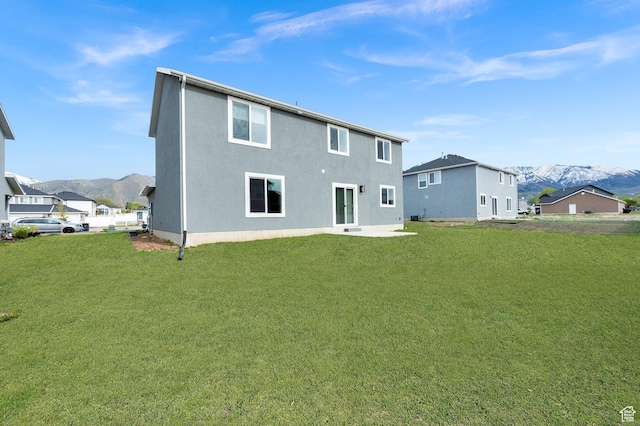 227 N 250 E, Salem, UT 84653 - back of property featuring a patio area, a lawn, stucco siding, and a mountain view