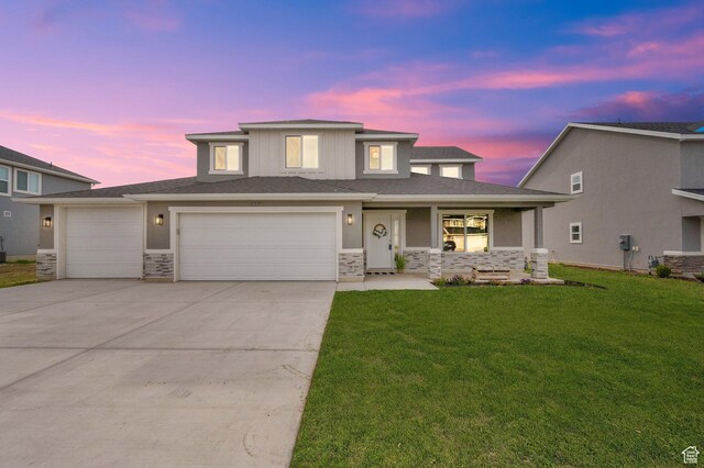 227 N 250 E, Salem, UT 84653 - prairie-style home featuring covered porch, stone siding, a front yard, and concrete driveway
