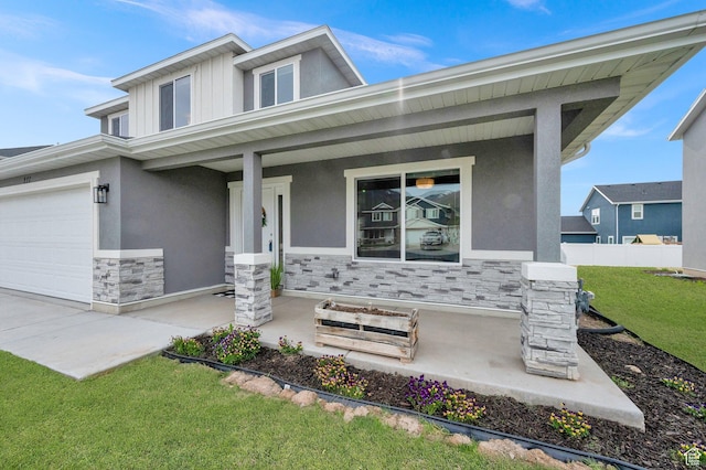 227 N 250 E, Salem, UT 84653 - prairie-style home featuring a porch, a garage, stone siding, stucco siding, and fence