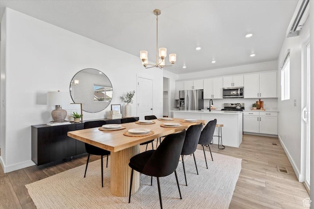 1158 E Bearing Dr S, Saratoga Springs, UT 84045 - dining area with light wood-type flooring, baseboards, a notable chandelier, visible vents, and recessed lighting