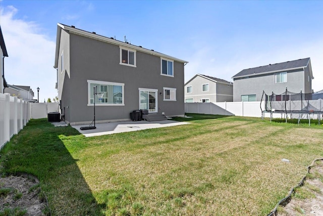 1158 E Bearing Dr S, Saratoga Springs, UT 84045 - back of house featuring a fenced backyard, central AC unit, a trampoline, a lawn, and a patio
