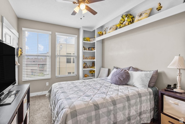 bedroom featuring carpet floors, a ceiling fan, and baseboards