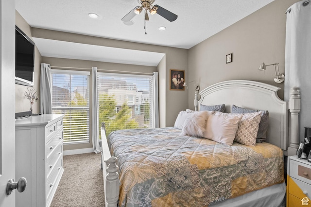 bedroom featuring recessed lighting, a ceiling fan, baseboards, and light carpet