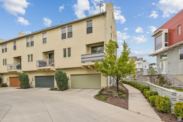 view of property with an attached garage and driveway