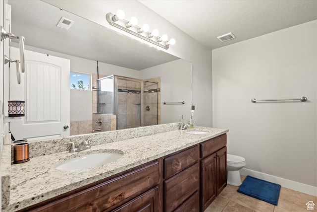 286 S Bing Cherry Way, Layton, UT 84040 - bathroom with a shower stall, visible vents, tile patterned flooring, and a sink