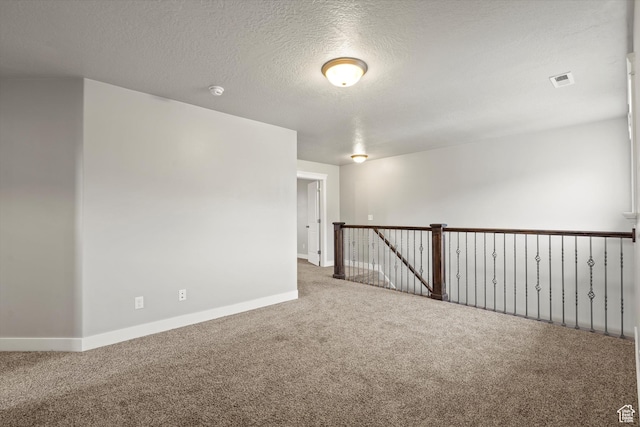 286 S Bing Cherry Way, Layton, UT 84040 - spare room featuring visible vents, baseboards, carpet floors, and a textured ceiling