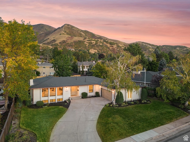 1075 S Alton Way E, Salt Lake City, UT 84108 - ranch-style house with driveway, a front lawn, and a mountain view