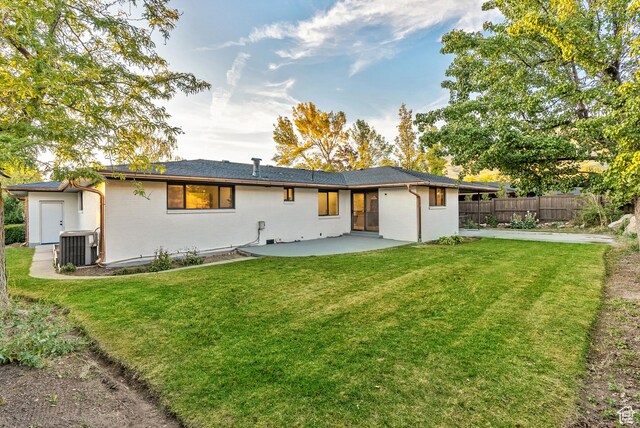 1075 S Alton Way E, Salt Lake City, UT 84108 - rear view of property with fence, a yard, central AC, and a patio