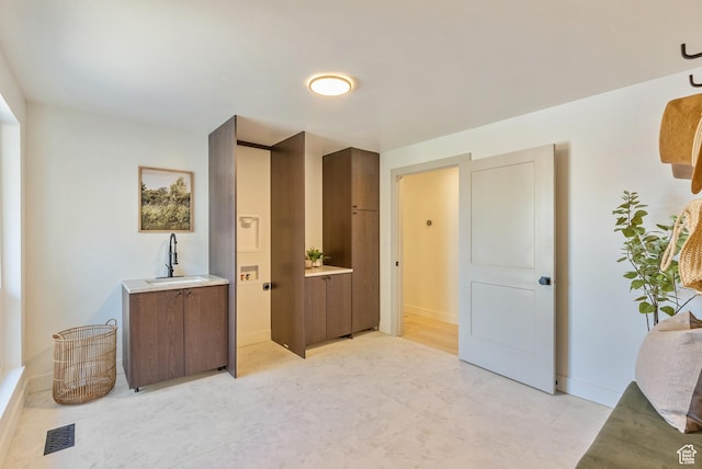 1075 S Alton Way E, Salt Lake City, UT 84108 - bedroom with baseboards, a sink, visible vents, and light tile patterned floors