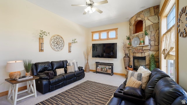 1229 E 1710 S, Spanish Fork, UT 84660 - living area with carpet, a stone fireplace, baseboards, and ceiling fan