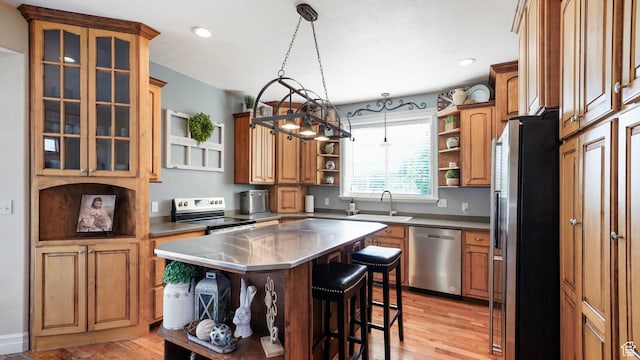 1229 E 1710 S, Spanish Fork, UT 84660 - kitchen featuring open shelves, a sink, a kitchen bar, stainless steel counters, and appliances with stainless steel finishes