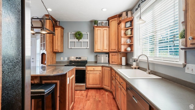 1229 E 1710 S, Spanish Fork, UT 84660 - kitchen featuring light wood-style flooring, a sink, appliances with stainless steel finishes, open shelves, and a breakfast bar area