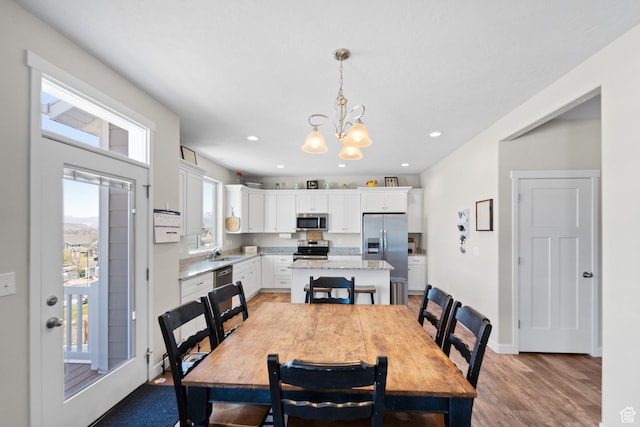 2671 E White Birch Dr, Eagle Mountain, UT 84005 - dining room featuring baseboards, a chandelier, light wood finished floors, and recessed lighting