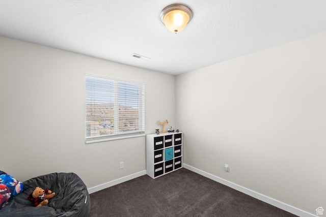 2671 E White Birch Dr, Eagle Mountain, UT 84005 - living area with dark carpet, visible vents, and baseboards