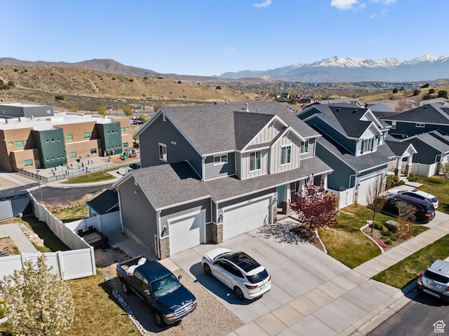 drone / aerial view featuring a mountain view and a residential view
