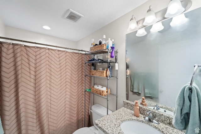 2671 E White Birch Dr, Eagle Mountain, UT 84005 - bathroom featuring toilet, a shower with curtain, vanity, and visible vents