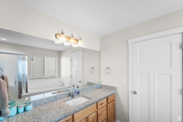2671 E White Birch Dr, Eagle Mountain, UT 84005 - full bathroom with a garden tub, vanity, and a stall shower