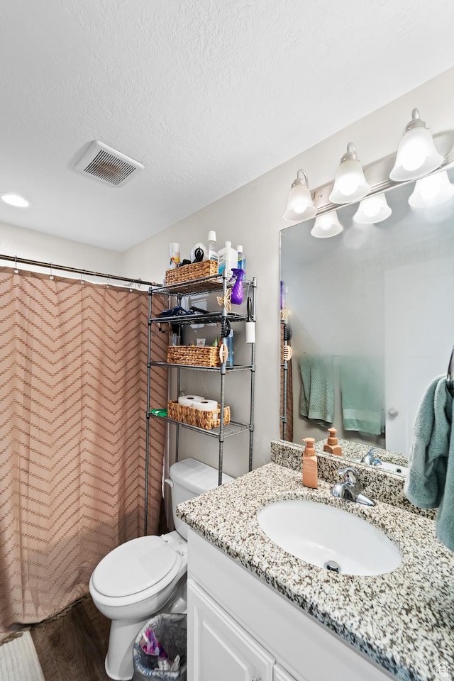 2671 E White Birch Dr, Eagle Mountain, UT 84005 - full bathroom featuring wood finished floors, visible vents, toilet, vanity, and a shower with curtain
