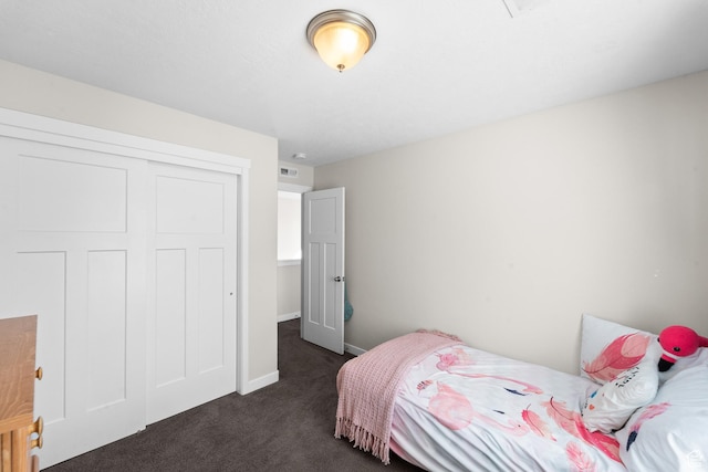 2671 E White Birch Dr, Eagle Mountain, UT 84005 - bedroom featuring dark carpet, a closet, baseboards, and visible vents
