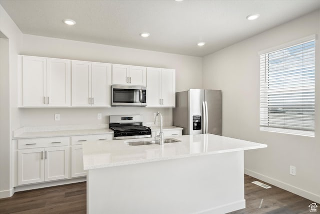 3509 N Gina St Unit 1230, Eagle Mountain, UT 84005 - kitchen with appliances with stainless steel finishes, dark wood-style floors, white cabinetry, a kitchen island with sink, and recessed lighting