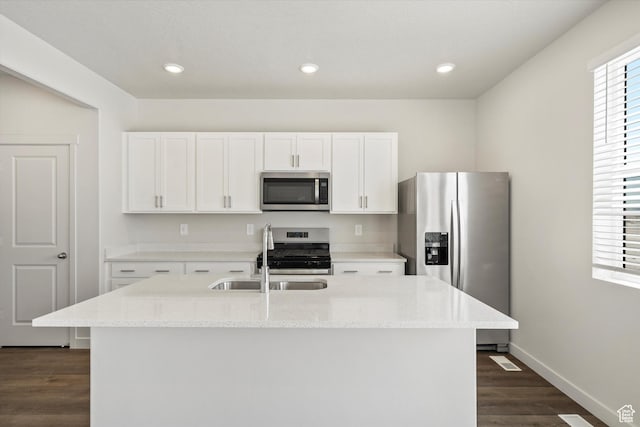 3509 N Gina St Unit 1230, Eagle Mountain, UT 84005 - kitchen featuring stainless steel appliances, dark wood-style floors, white cabinetry, light stone countertops, and recessed lighting