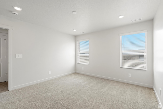 3509 N Gina St Unit 1230, Eagle Mountain, UT 84005 - spare room with light carpet, a smoke detector, and recessed lighting
